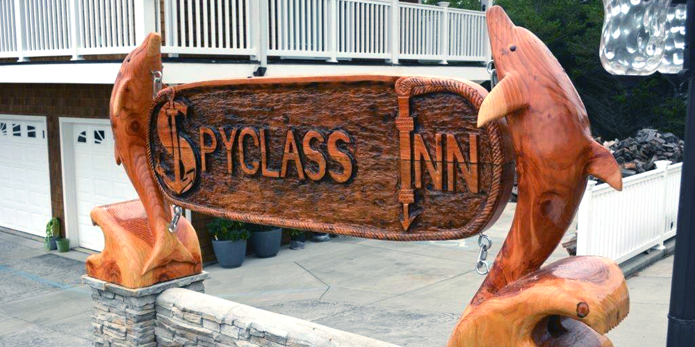 The new Spyglass Inn sign was a culmination of two of the best talents in the cove. K & M Masonry and Bruce Willis, woodcarver, produced this eclectic masterpiece that greets our guests upon arrival.